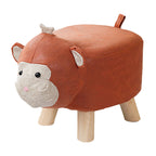 Children's stool shaped like a cow with brown body, white face, and wooden legs on a white background.