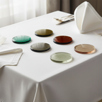 Set of six round hammered glass coasters in various colors on a white background