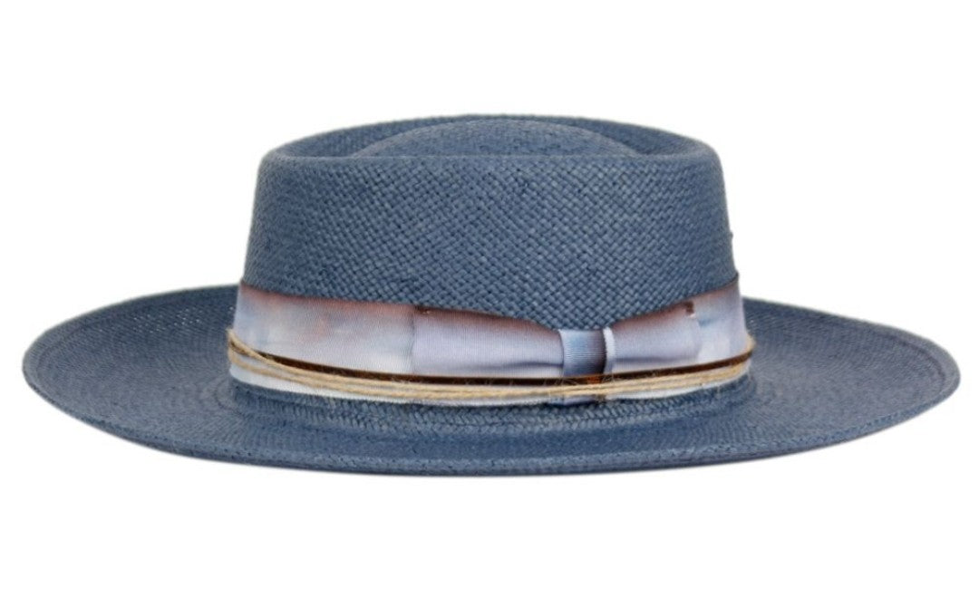 Blue straw hat with a ribbon band on a white background