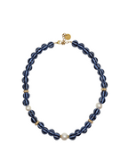 Blue pearl necklace with gold accents on a white background