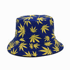 Blue bucket hat with yellow cannabis leaf pattern on a white background