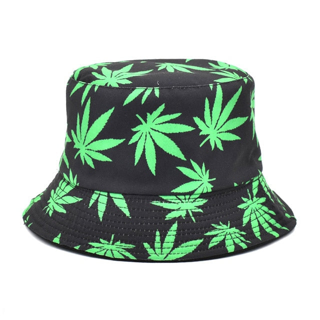 Black bucket hat with green leaf pattern on a white background