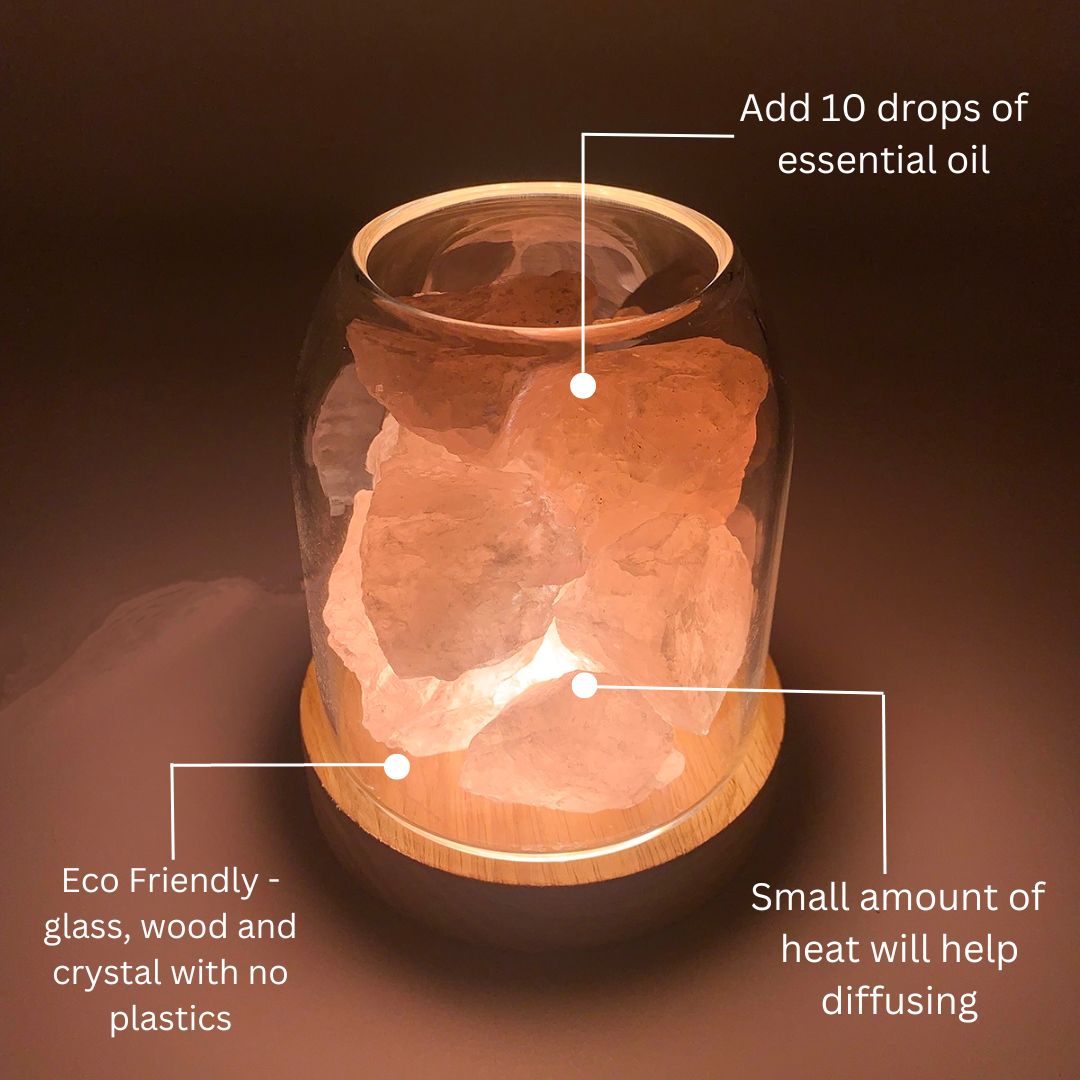 Diffuser with wooden base and glass container, labeled with usage instructions.