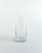 Clear glass bottle on a white background