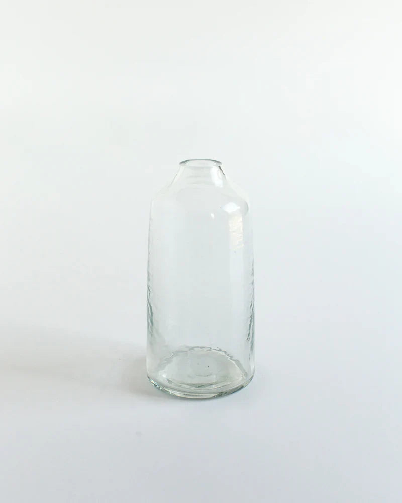 Clear glass bottle on a white background