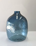 Blue glass vase on a white background